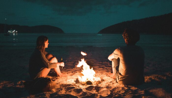 Couple in love on beach considering prenup