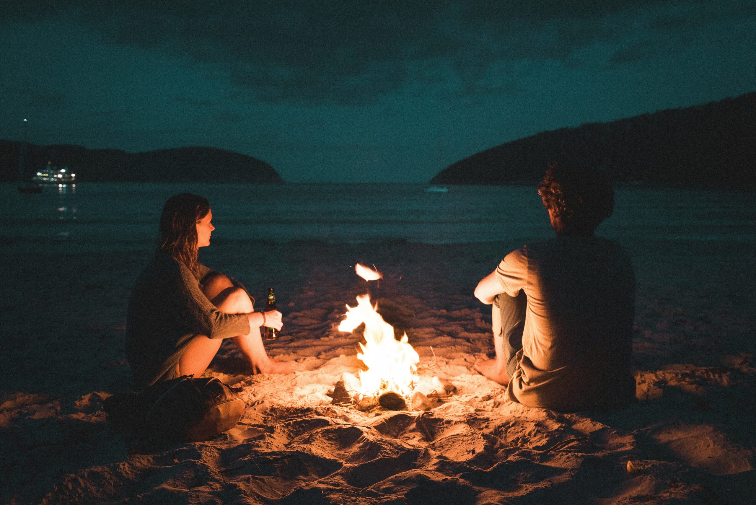 Couple in love on beach considering prenup