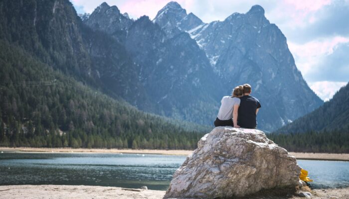 Couple near lake and mountain