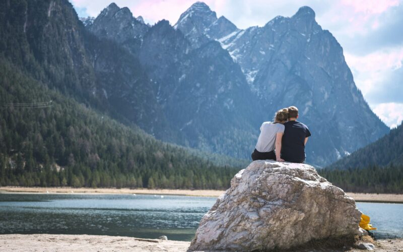 Couple near lake and mountain